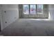 Room with three windows and cement floor with electrical outlets at 548 Jocund St # 15, Rolesville, NC 27571