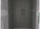 A partially-tiled shower is equipped with a built-in niche at 548 Jocund St # 15, Rolesville, NC 27571