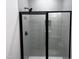 Bathroom shower with black trim glass, light subway tile, and rain shower head at 548 Jocund St # 15, Rolesville, NC 27571