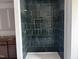 This shower features vertically stacked tile with a built-in niche and contrasting grout at 548 Jocund St # 15, Rolesville, NC 27571