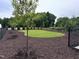 Landscaped backyard featuring a well-maintained lawn and a black fence at 564 Jocund St # 11, Rolesville, NC 27571