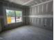 Bright, unfinished bedroom with a large window offering scenic views at 564 Jocund St # 11, Rolesville, NC 27571