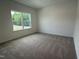 Bedroom with neutral carpet and window offering natural light at 564 Jocund St # 11, Rolesville, NC 27571