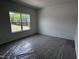 Bedroom featuring a large window allowing natural light to illuminate the space at 564 Jocund St # 11, Rolesville, NC 27571
