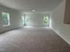 Bright bonus room features plush carpeting and natural light from large windows at 564 Jocund St # 11, Rolesville, NC 27571