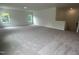 Spacious bonus room with neutral carpet, windows, and access to stairs at 564 Jocund St # 11, Rolesville, NC 27571