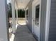 Inviting covered front porch with white columns and a gray exterior offers a warm welcome at 564 Jocund St # 11, Rolesville, NC 27571