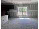 Spacious kitchen with modern dark cabinets awaiting finishing touches, perfect for culinary creations at 564 Jocund St # 11, Rolesville, NC 27571