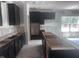 Unfinished modern kitchen with sleek, dark cabinets and a functional layout at 564 Jocund St # 11, Rolesville, NC 27571