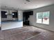 Open kitchen layout with dark cabinetry, a center island, and stainless appliances, merging style and functionality at 564 Jocund St # 11, Rolesville, NC 27571