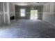 Expansive living room featuring a fireplace, sliding doors to the outside, and a large window at 564 Jocund St # 11, Rolesville, NC 27571