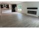Spacious, open-concept living area with hardwood floors, fireplace, and a modern kitchen at 564 Jocund St # 11, Rolesville, NC 27571