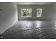Bright living room featuring large windows and neutral walls at 564 Jocund St # 11, Rolesville, NC 27571