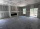 Spacious living room featuring a modern fireplace and sliding glass doors to the outdoors at 564 Jocund St # 11, Rolesville, NC 27571