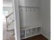Bright mudroom with a built-in bench, cubbies, and hooks for organized storage near the entrance at 564 Jocund St # 11, Rolesville, NC 27571