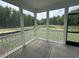 Relaxing screened porch with views of lush greenery and landscaping at 564 Jocund St # 11, Rolesville, NC 27571