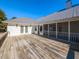 Expansive wooden deck with access to the house and screened-in porch at 5715 Sky Lane Dr, Durham, NC 27704
