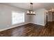 Bright dining room with hardwood floors and modern lighting at 5715 Sky Lane Dr, Durham, NC 27704