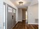 Welcoming entryway featuring hardwood floors and stylish lighting at 5715 Sky Lane Dr, Durham, NC 27704