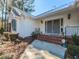 Charming home featuring a brick entryway, metal roof, and manicured landscaping at 5715 Sky Lane Dr, Durham, NC 27704
