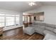Open living room with large windows and hardwood floors at 5715 Sky Lane Dr, Durham, NC 27704