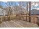 The wooden back deck overlooks the wooded lot and provides space for outdoor living at 700 Grandview Dr, Durham, NC 27703