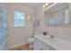 Well-lit bathroom with a vanity, toilet, and shower-tub with modern fixtures at 700 Grandview Dr, Durham, NC 27703