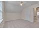 Comfortable bedroom with carpet, sloped ceilings, and ensuite bathroom access at 700 Grandview Dr, Durham, NC 27703