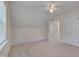 Neutral bedroom boasts carpet, white trim, a ceiling fan, and two entryways at 700 Grandview Dr, Durham, NC 27703