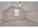 Cozy bedroom with a vaulted ceiling, plush carpeting, and natural light at 700 Grandview Dr, Durham, NC 27703