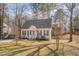 Charming house with white siding, black shutters, and a well-maintained lawn at 700 Grandview Dr, Durham, NC 27703