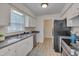 Kitchen features updated appliances, ample counter space, and a bright window at 700 Grandview Dr, Durham, NC 27703