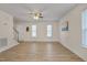 Bright living room with two windows and a staircase visible from the front door at 700 Grandview Dr, Durham, NC 27703