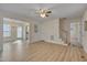 Open living area with hardwood floors, staircase and view into the dining area and kitchen at 700 Grandview Dr, Durham, NC 27703