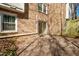 Brick home backyard with concrete patio and sliding glass door at 706 Collington Dr, Cary, NC 27511