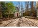 Backyard features a concrete patio, fenced yard, and two storage sheds at 706 Collington Dr, Cary, NC 27511
