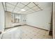 Unfinished basement space featuring paneled ceiling and patterned vinyl floors at 706 Collington Dr, Cary, NC 27511