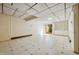 Unfinished basement with paneled walls, slider door, and built-in shelving at 706 Collington Dr, Cary, NC 27511