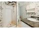 Compact bathroom featuring a walk-in shower and funky printed wallpaper at 706 Collington Dr, Cary, NC 27511