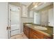 Vintage bathroom featuring a dual-sink vanity and an adjacent shower at 706 Collington Dr, Cary, NC 27511