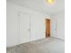 Bedroom with neutral carpet, white trim, and large closet space at 706 Collington Dr, Cary, NC 27511