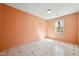 Bedroom featuring peach walls, one window, and patterned vinyl flooring at 706 Collington Dr, Cary, NC 27511