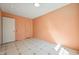 Bedroom with paneled walls, two closets, and patterned vinyl flooring at 706 Collington Dr, Cary, NC 27511