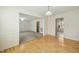 Open dining area with wood floors and an open view into the adjacent living room at 706 Collington Dr, Cary, NC 27511