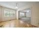 Bright dining area with wood floors and an open view into the adjacent living room at 706 Collington Dr, Cary, NC 27511