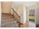 Bright foyer with parquet floors, carpeted stairs, and a view of the outdoors at 706 Collington Dr, Cary, NC 27511