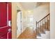 Inviting foyer with parquet floors and a staircase leading to the upper level at 706 Collington Dr, Cary, NC 27511