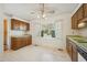 Spacious kitchen with wooden cabinets, laminate countertops, and a bright bay window at 706 Collington Dr, Cary, NC 27511