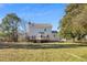 Exterior view of the house, deck, and fenced-in yard at 716 S Meadow Rd, Raleigh, NC 27603
