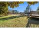 The backyard has a utility shed and wooden deck attached to the house at 716 S Meadow Rd, Raleigh, NC 27603